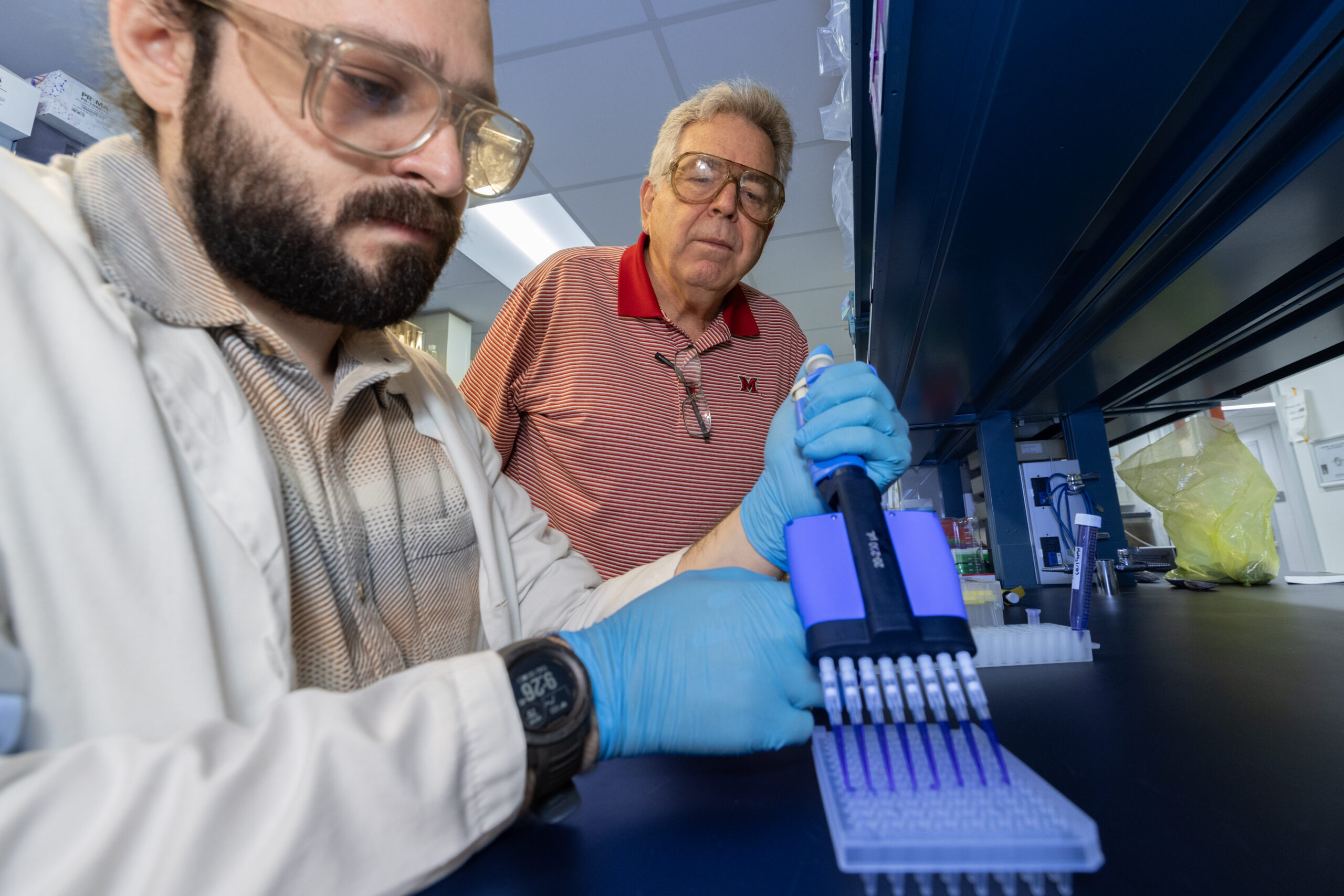 Professor of Biology David Berg with Students doing research