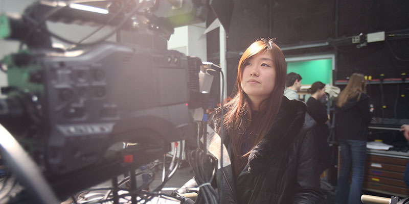 Student in front of studio camera