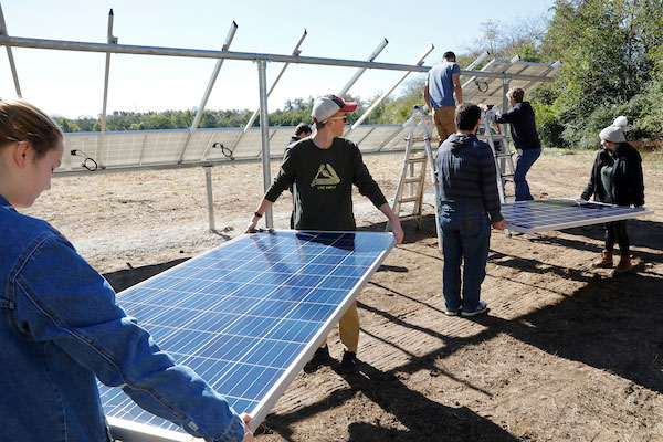Students install solar panels