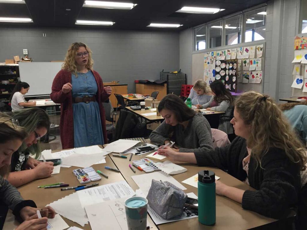 Hanna McCarren leads an art therapy exercise.