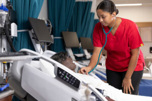 nursing student practicing on a dummy