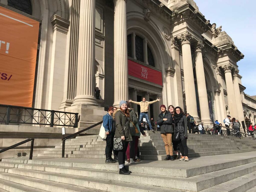 Miami University students stand on the steps of The Met in New York City during an animation program field trip.
