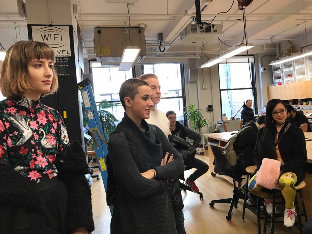 Animation students from Miami University observe a demonstration in a creative lab during a hands-on learning session.